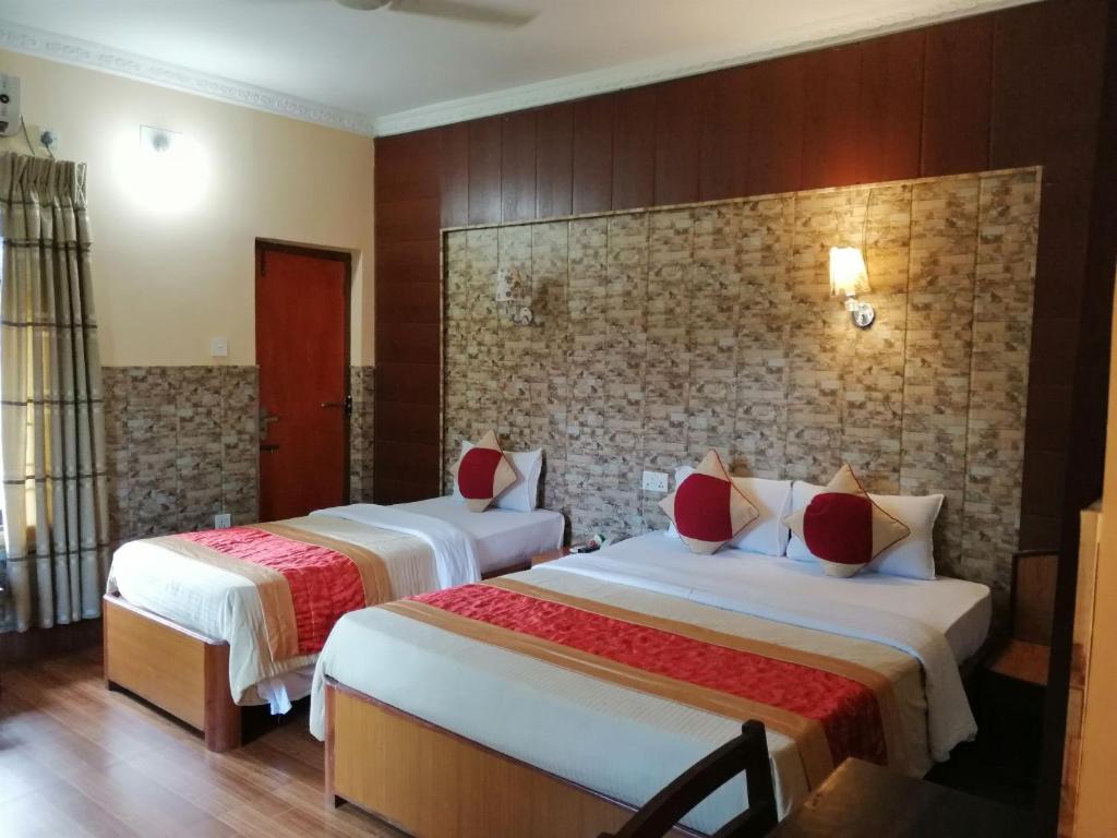 Postel nebo postele na pokoji v ubytování Hotel Wildlife Camp