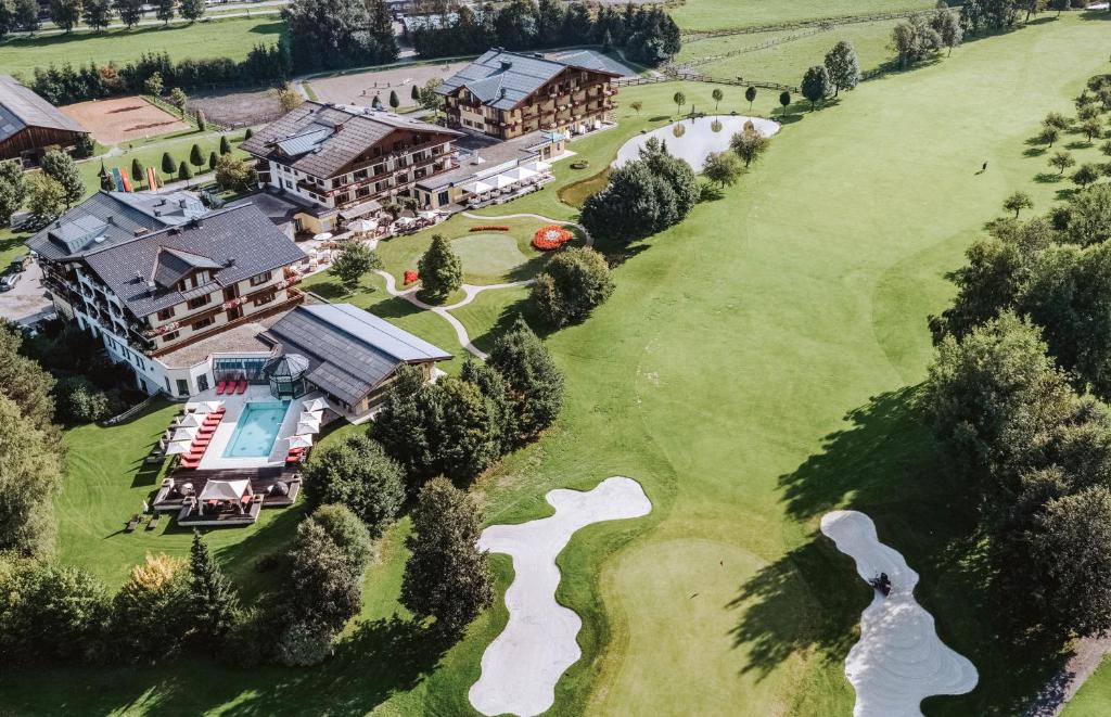 an aerial view of a resort with a putting green at Gut Weissenhof in Radstadt