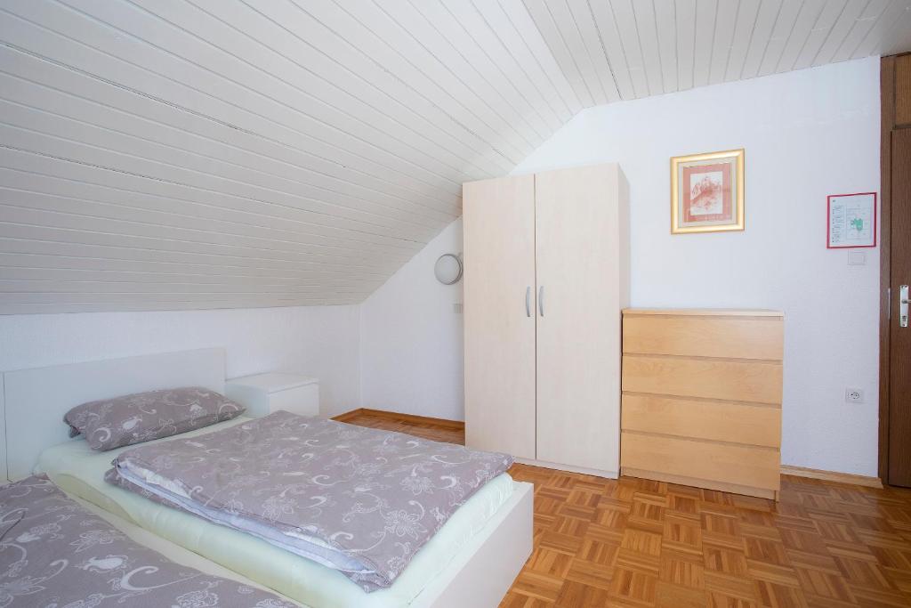 Postel nebo postele na pokoji v ubytování Apartment Harmony Bled