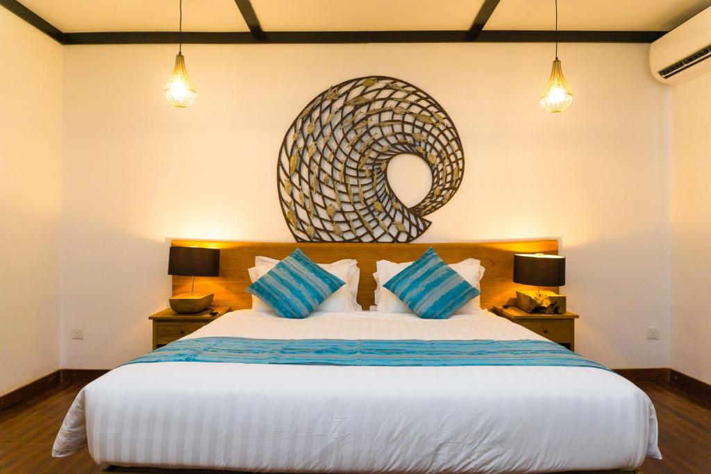 Postel nebo postele na pokoji v ubytování Borneo Divers Mabul Resort