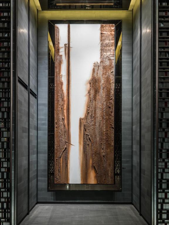a room with a large painting on the wall at Four Seasons Hotel Seoul in Seoul
