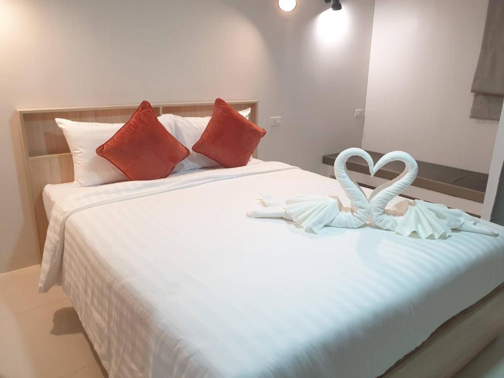 Postel nebo postele na pokoji v ubytování beHOME Phuket