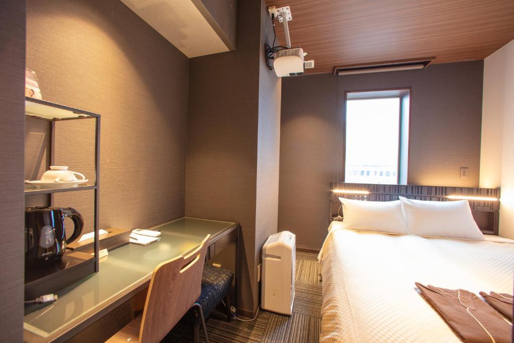Postel nebo postele na pokoji v ubytování JHotelTokyoGEO