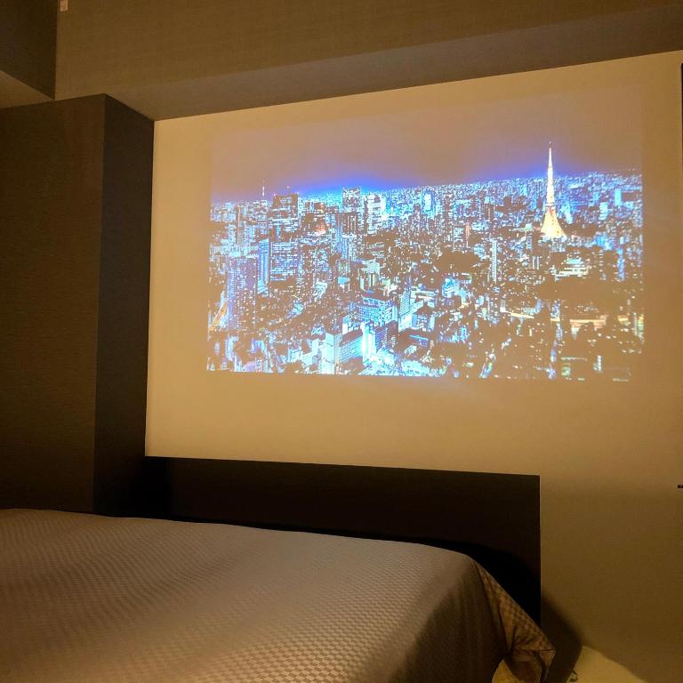 Postel nebo postele na pokoji v ubytování JHotelTokyoGEO