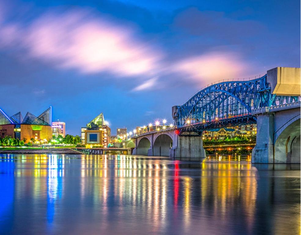 a bridge over a river with a city at night at Hotel Indigo Chattanooga - Downtown by IHG in Chattanooga