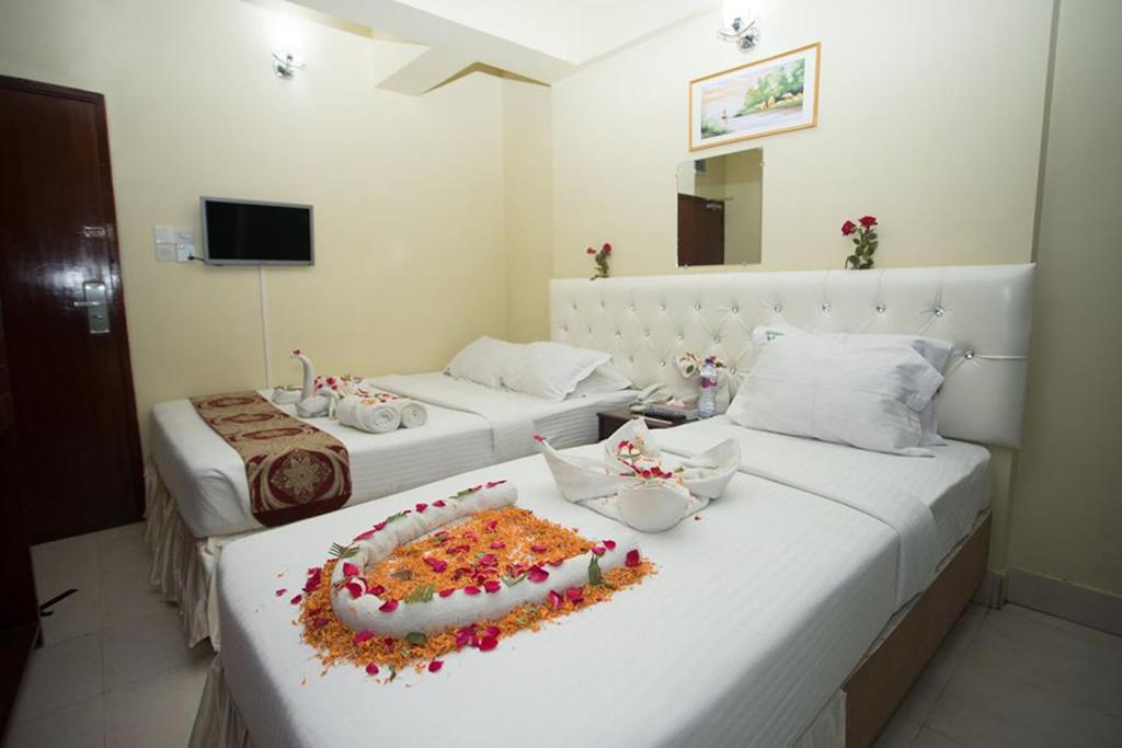 Llit o llits en una habitació de Hotel Vista Bay