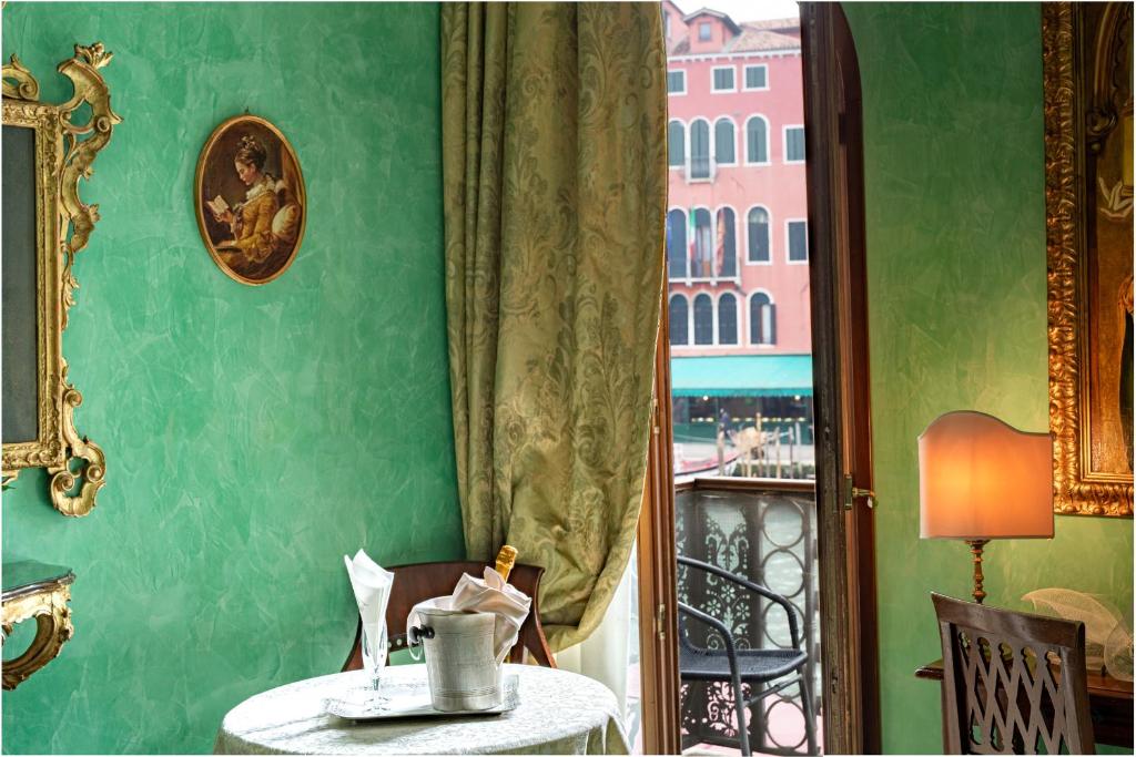 a dining room with a table and a window at Hotel Marconi in Venice