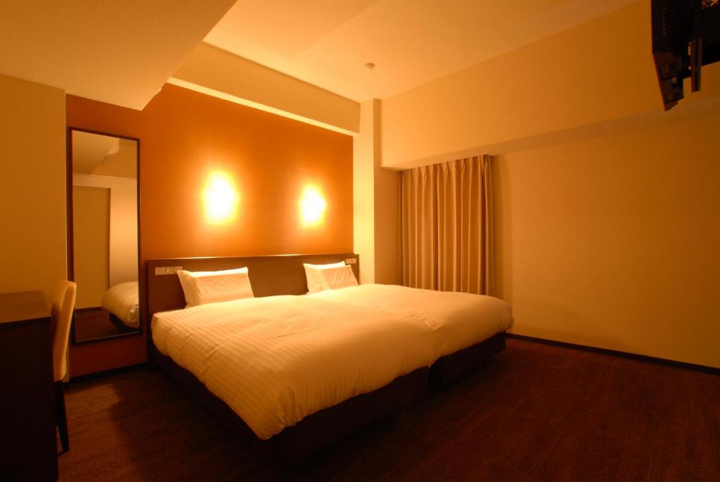 Postel nebo postele na pokoji v ubytování AB Hotel Nara