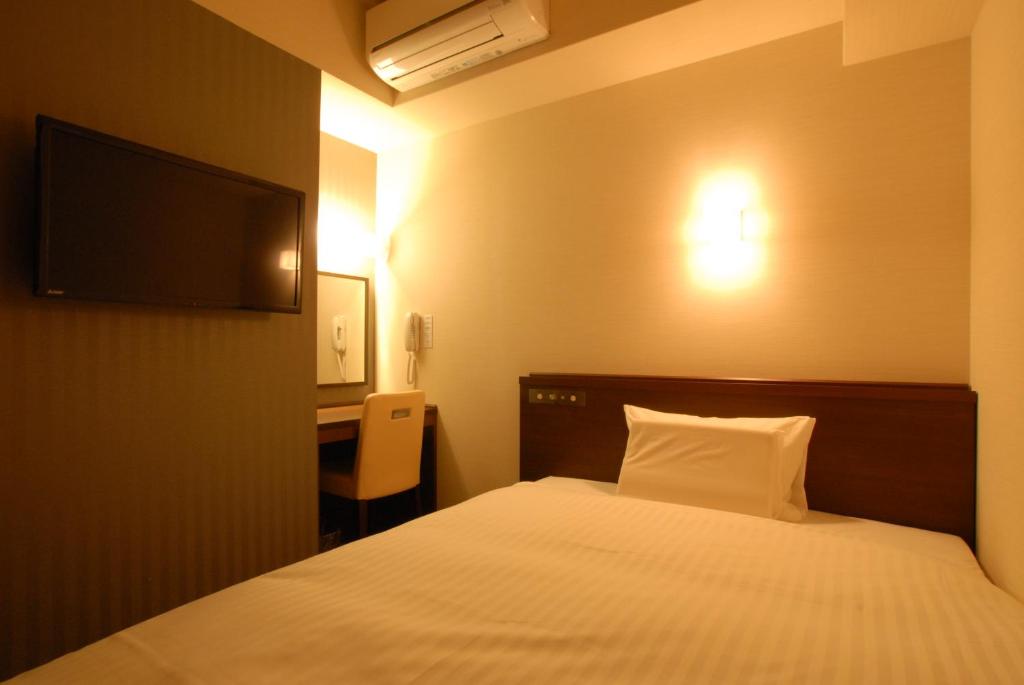 Postel nebo postele na pokoji v ubytování AB Hotel Nara