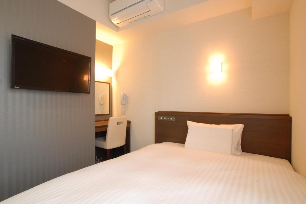 Postel nebo postele na pokoji v ubytování AB Hotel Nara