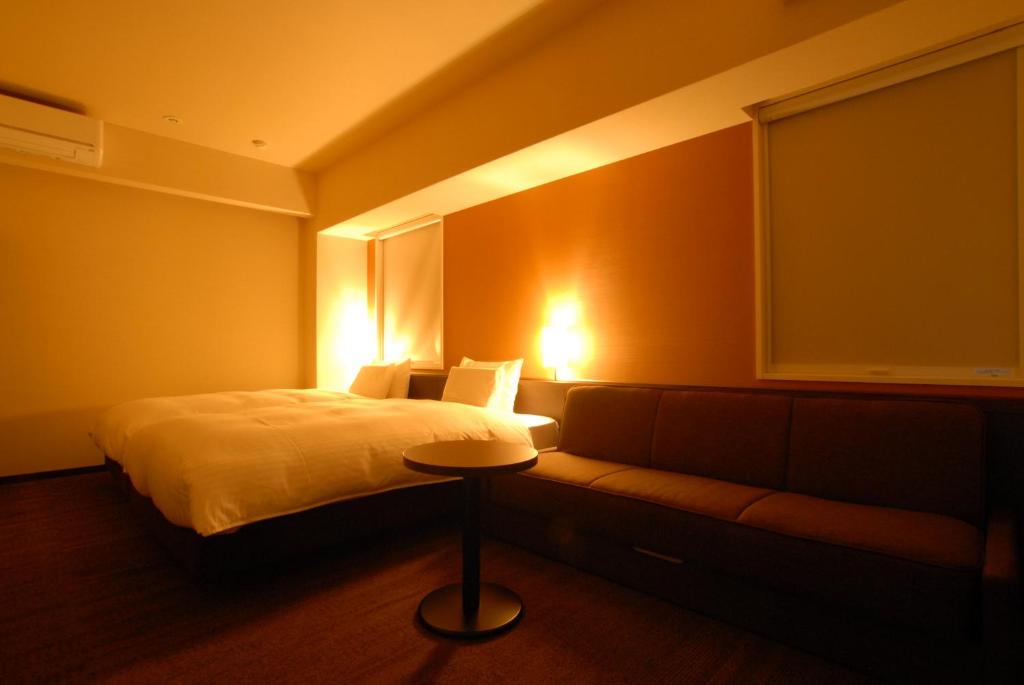 Postel nebo postele na pokoji v ubytování AB Hotel Nara