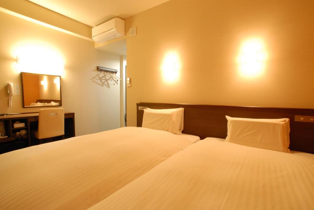 Postel nebo postele na pokoji v ubytování AB Hotel Nara