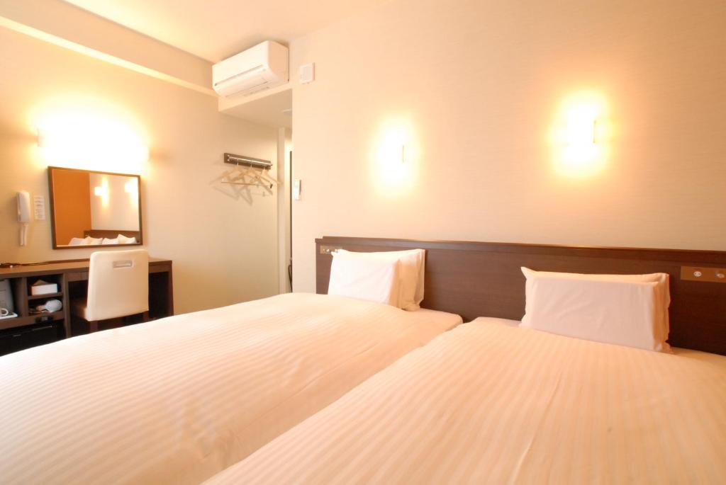 Postel nebo postele na pokoji v ubytování AB Hotel Nara