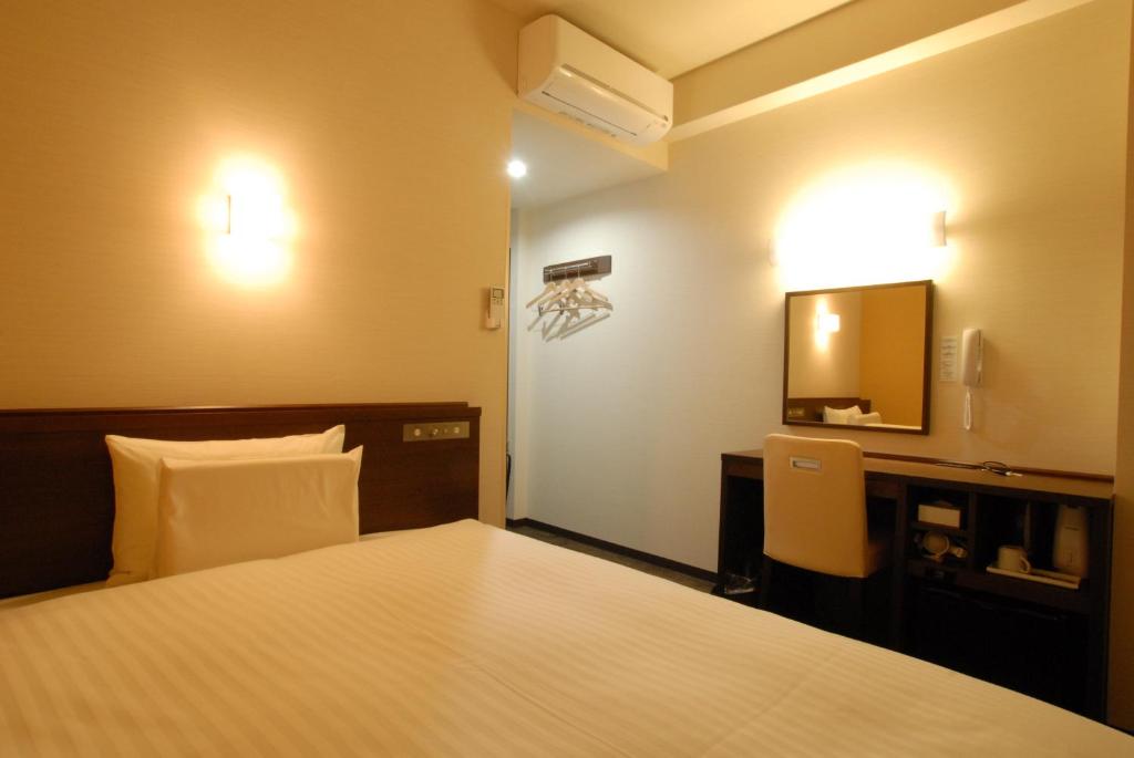 Postel nebo postele na pokoji v ubytování AB Hotel Nara