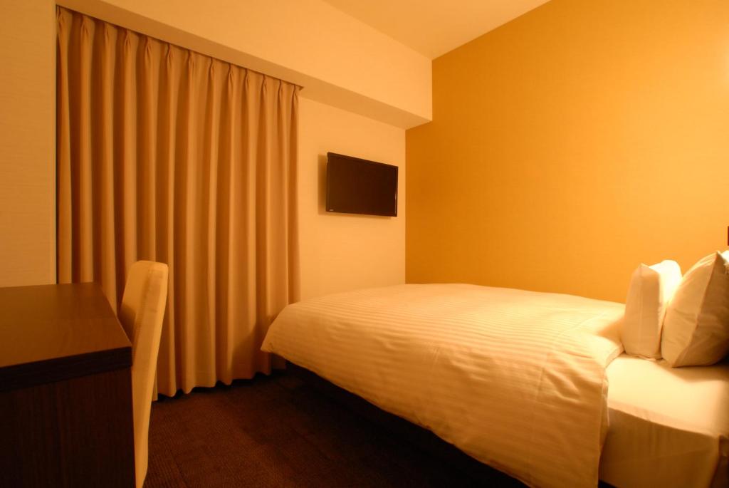 Postel nebo postele na pokoji v ubytování AB Hotel Nara