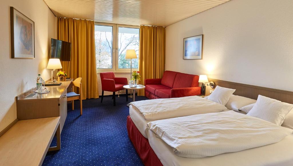Postel nebo postele na pokoji v ubytování Hotel Bayern Vital