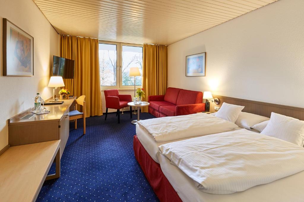 Postel nebo postele na pokoji v ubytování Hotel Bayern Vital