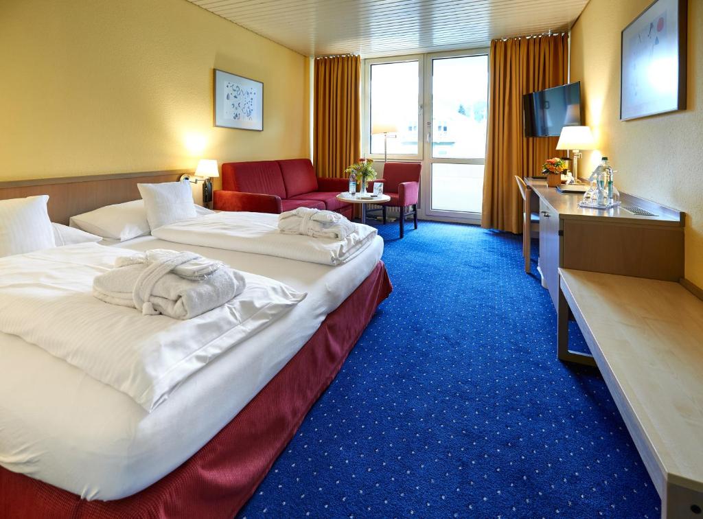 Postel nebo postele na pokoji v ubytování Hotel Bayern Vital