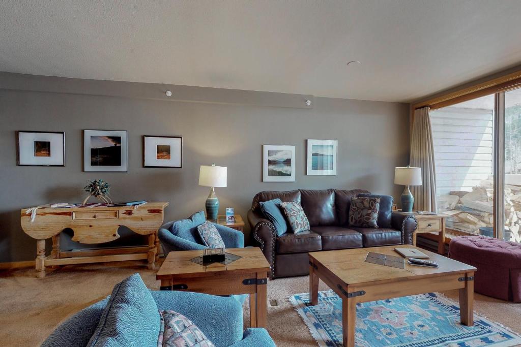 a living room with a couch and a table at Liftside Condominiums 203 in Keystone