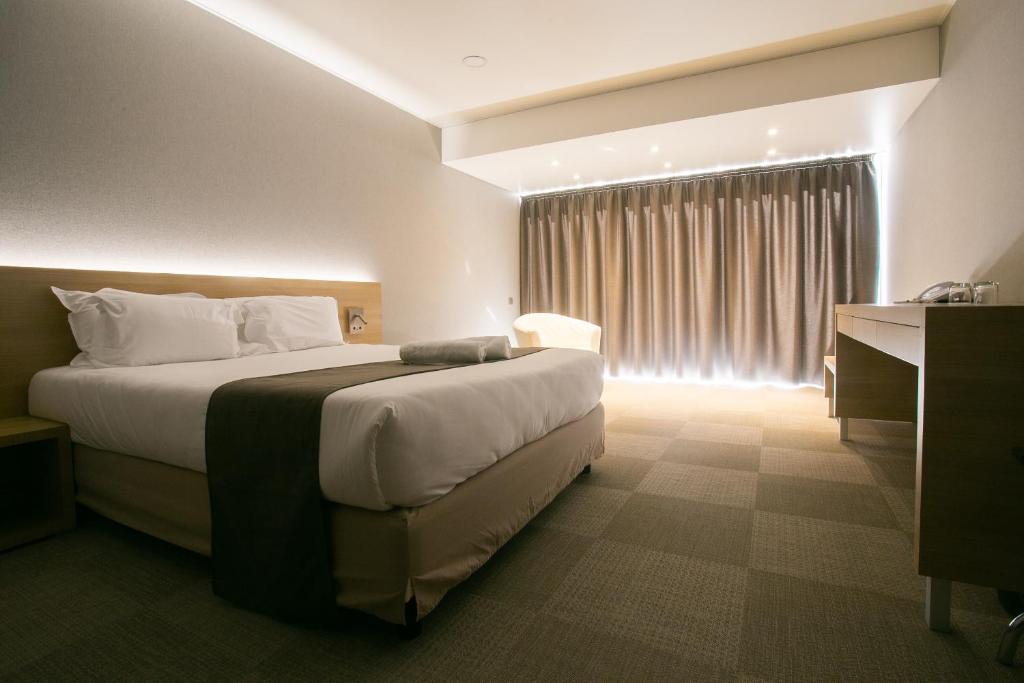 Postel nebo postele na pokoji v ubytování Hôtel Cala di Sole
