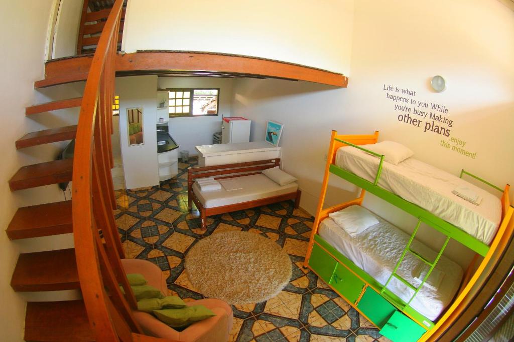 Cama ou camas em um quarto em Pousada Tubes Maresias