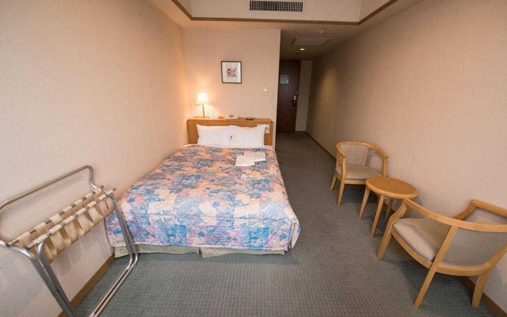 Postel nebo postele na pokoji v ubytování Hotel Mielparque Nagoya