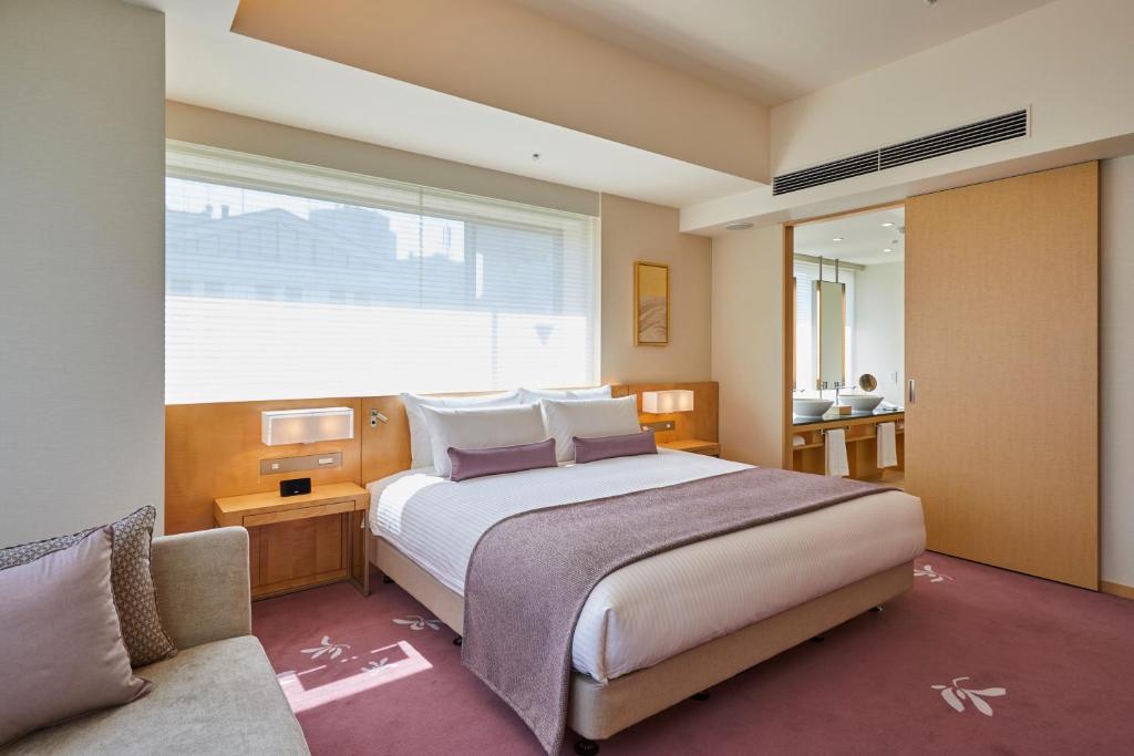 Postel nebo postele na pokoji v ubytování THE KITANO HOTEL TOKYO