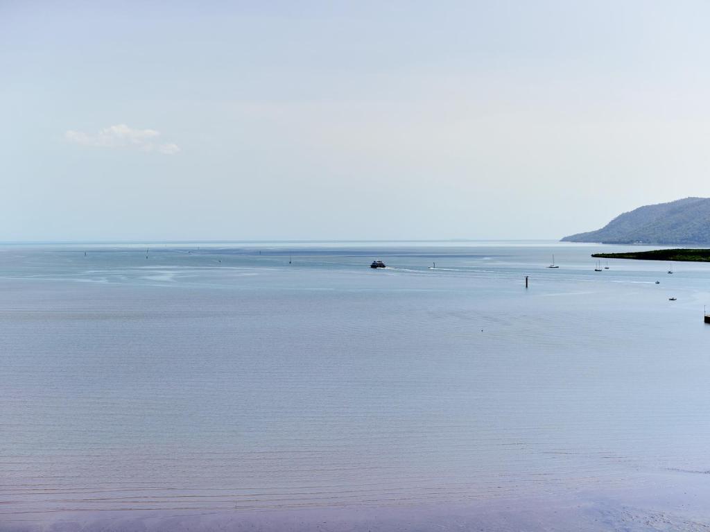 a beach with a large body of water at Crystalbrook Flynn in Cairns