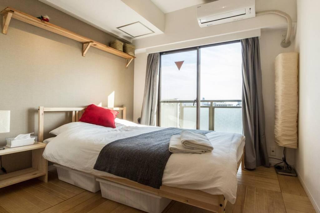 Ένα ή περισσότερα κρεβάτια σε δωμάτιο στο Dwell Urban 7C