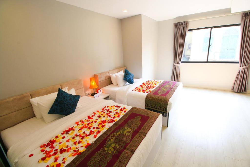 Postel nebo postele na pokoji v ubytování Ostro Hotel