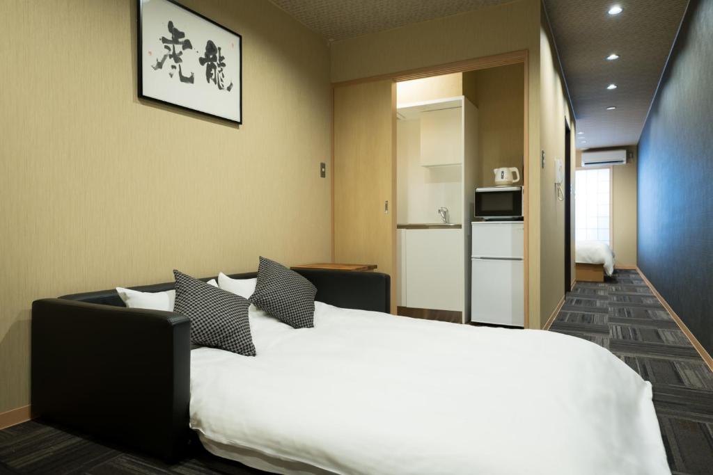 Kuchyň nebo kuchyňský kout v ubytování Shiki Suites - Kyoto Umekoji