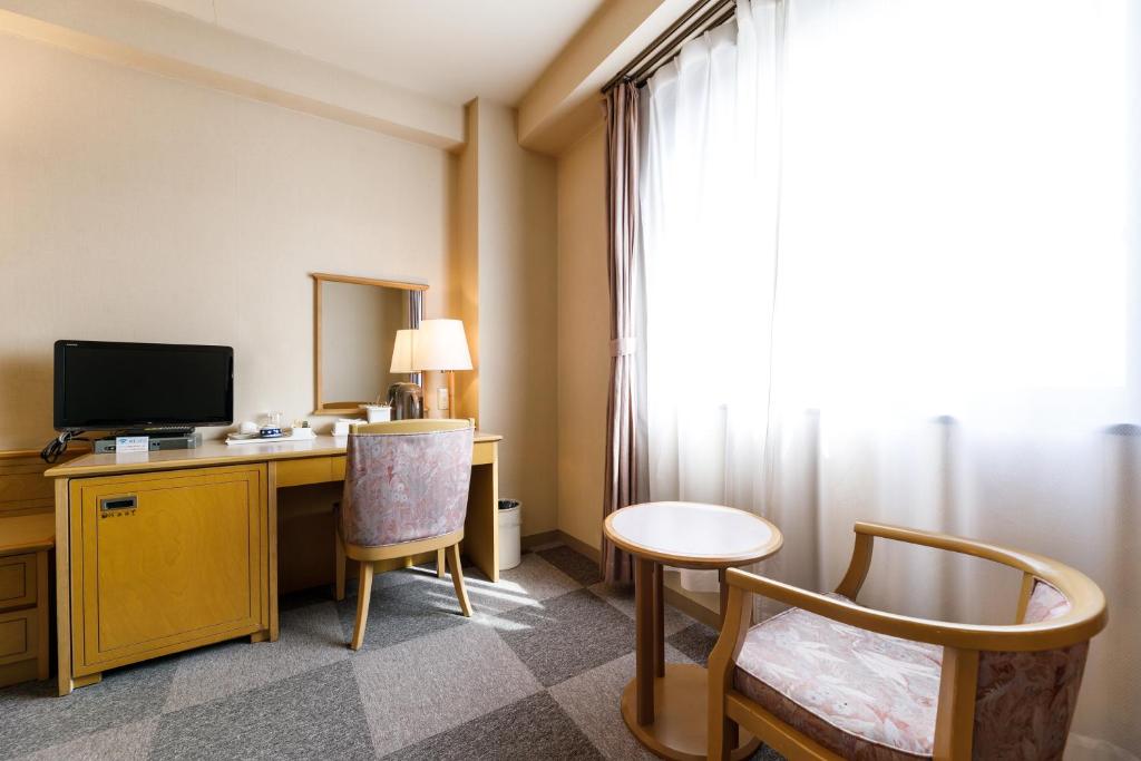 TV a/nebo společenská místnost v ubytování Fukuno Town Hotel A・Mieux