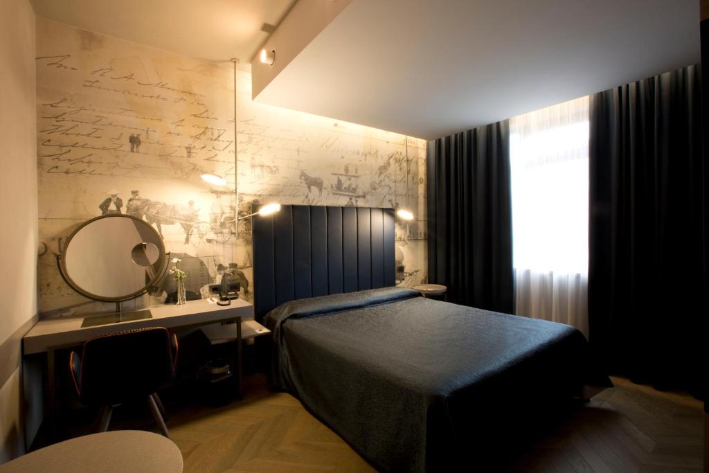 Postel nebo postele na pokoji v ubytování Palace Hotel Moderno