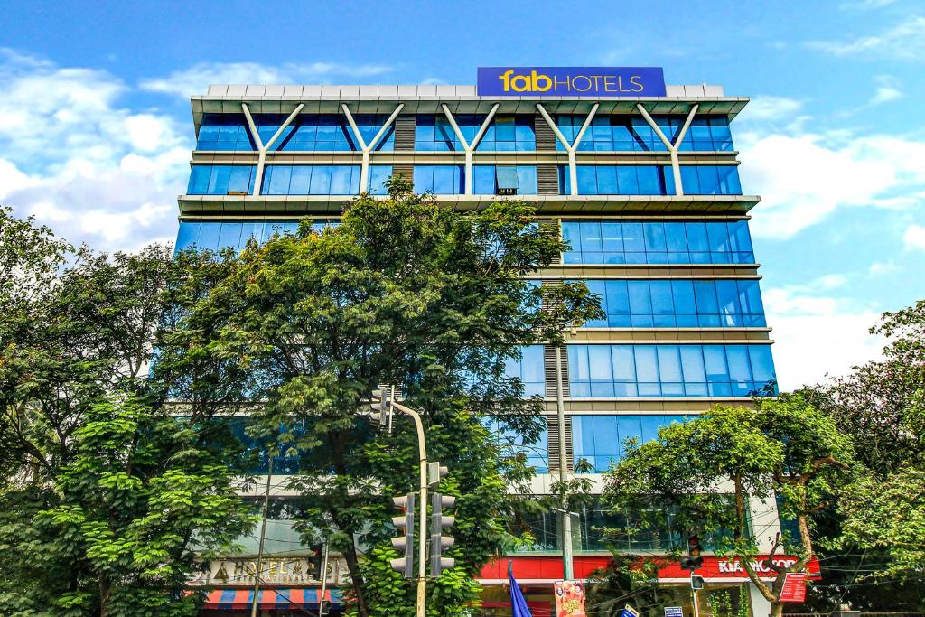 a tall building with a sign on top of it at FabHotel Axis International in Mumbai