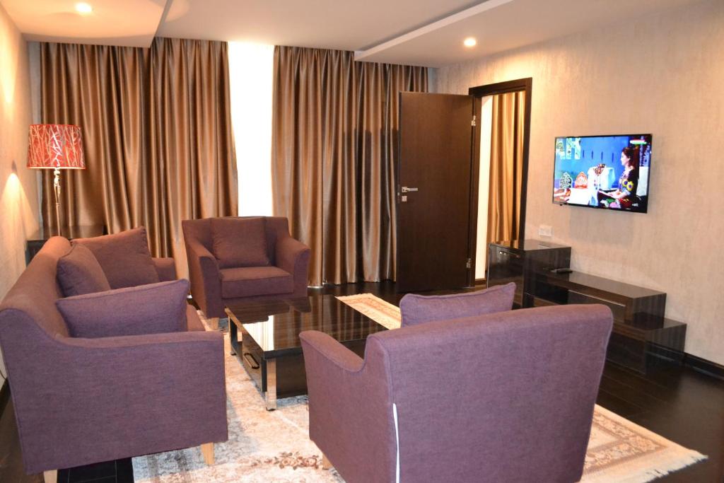 TV a/nebo společenská místnost v ubytování Pamir Palace