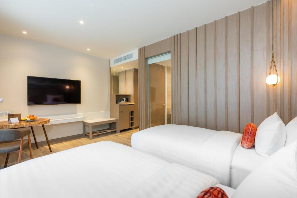 Postel nebo postele na pokoji v ubytování Maven Stylish Hotel Hua Hin