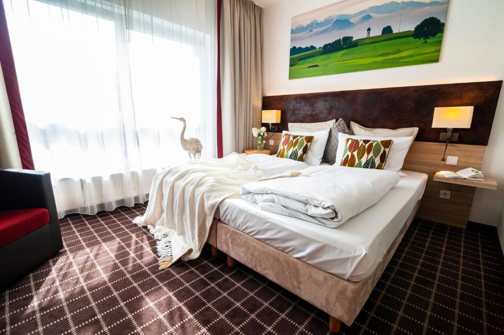 Postel nebo postele na pokoji v ubytování Business Class Hotel Ebersberg