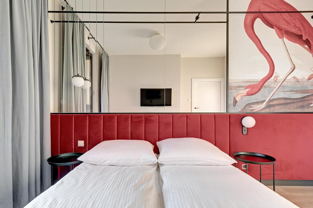 Posteľ alebo postele v izbe v ubytovaní Flamingo Beach Apartment