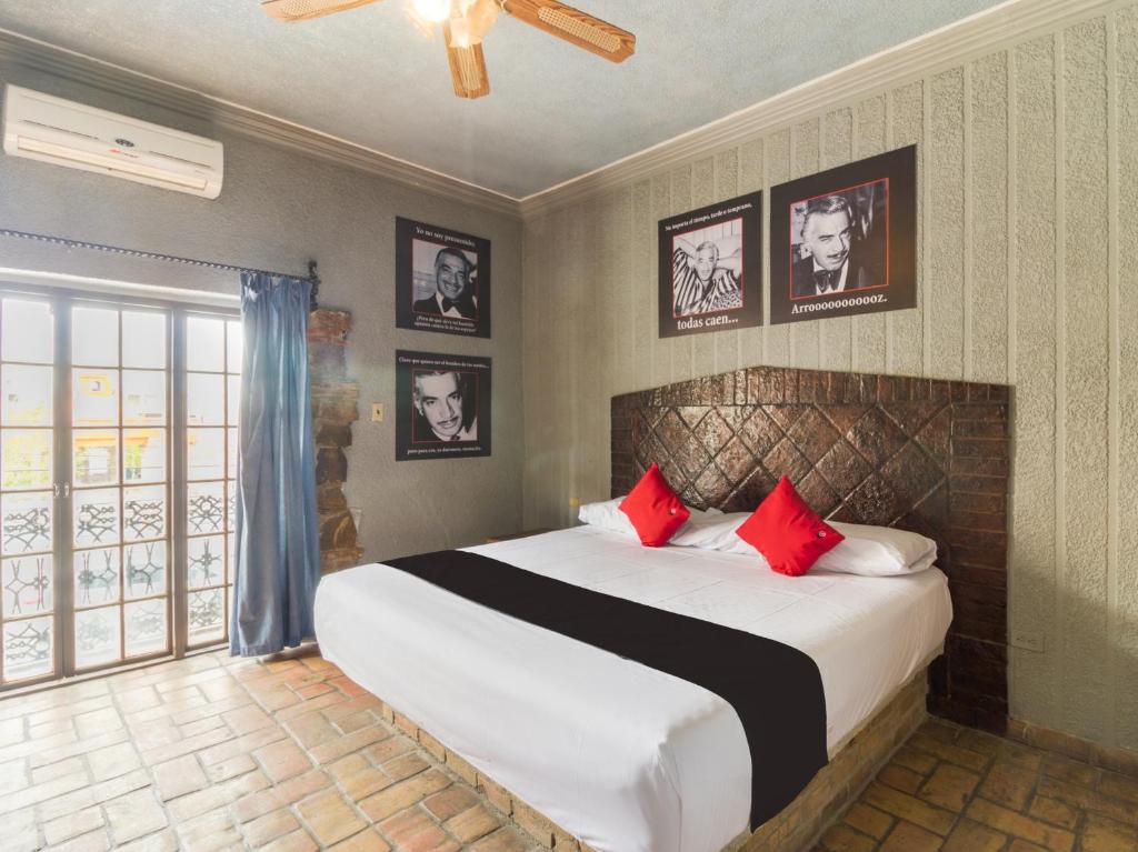 Ein Bett oder Betten in einem Zimmer der Unterkunft Hotel Olimpia