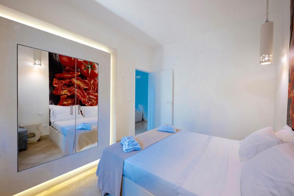 A bed or beds in a room at Tenuta Sidore