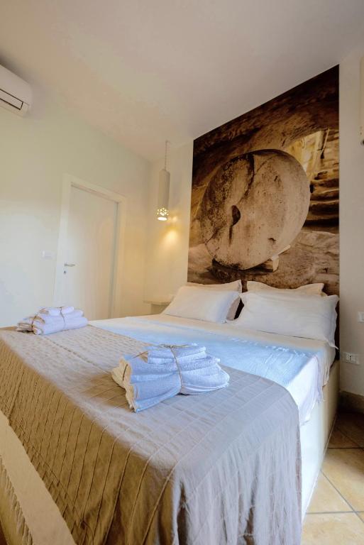 A bed or beds in a room at Tenuta Sidore