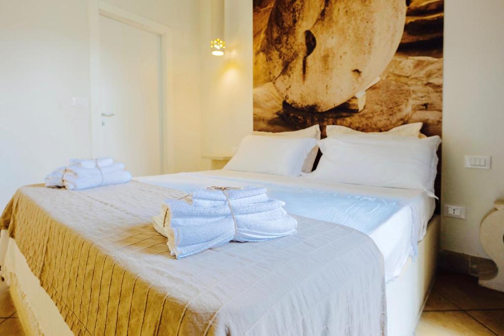 A bed or beds in a room at Tenuta Sidore
