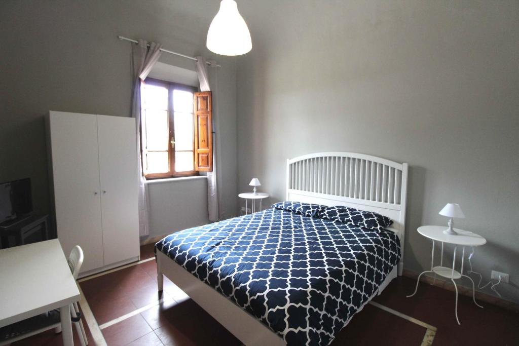 Postel nebo postele na pokoji v ubytování Le Cascine