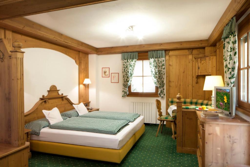 Postel nebo postele na pokoji v ubytování Chalet Barbara