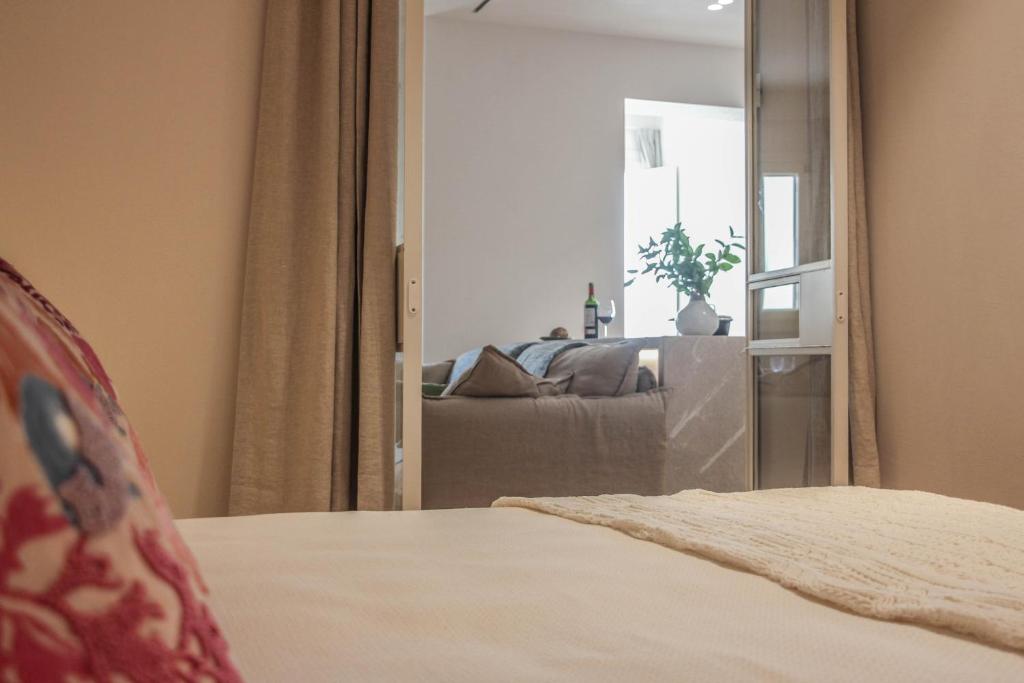 A bed or beds in a room at The Boc Suites
