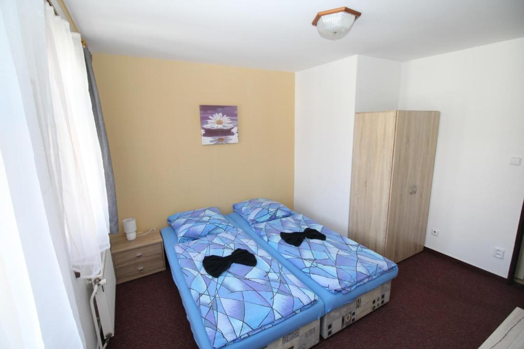 Postel nebo postele na pokoji v ubytování Penzion u Blanice
