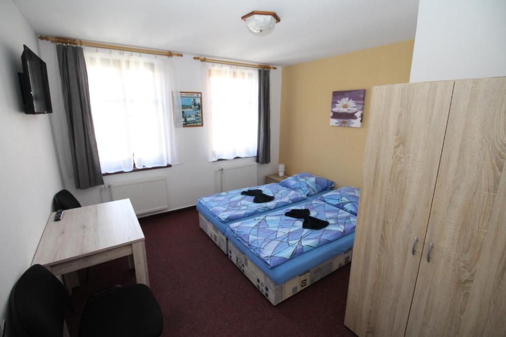 Postel nebo postele na pokoji v ubytování Penzion u Blanice