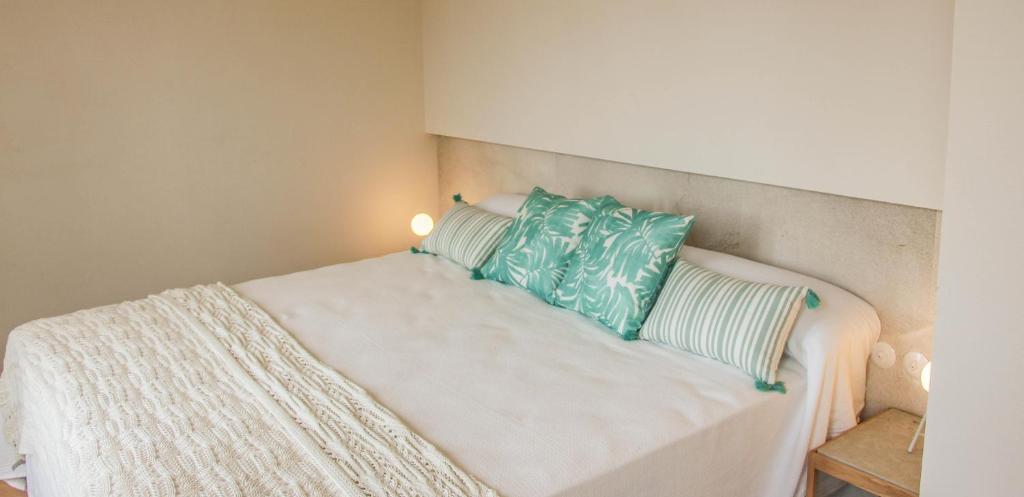 A bed or beds in a room at The Boc Suites