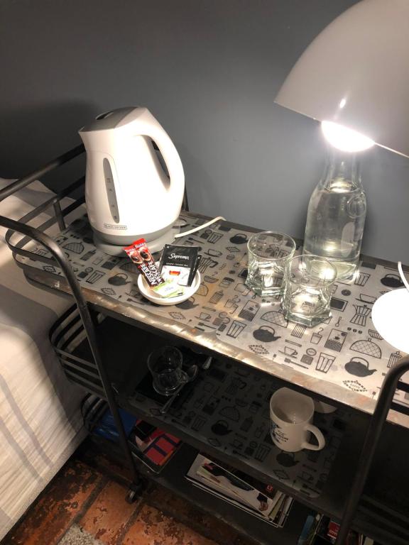 Příslušenství pro přípravu čaje a kávy v ubytování Rent apart Las Condes
