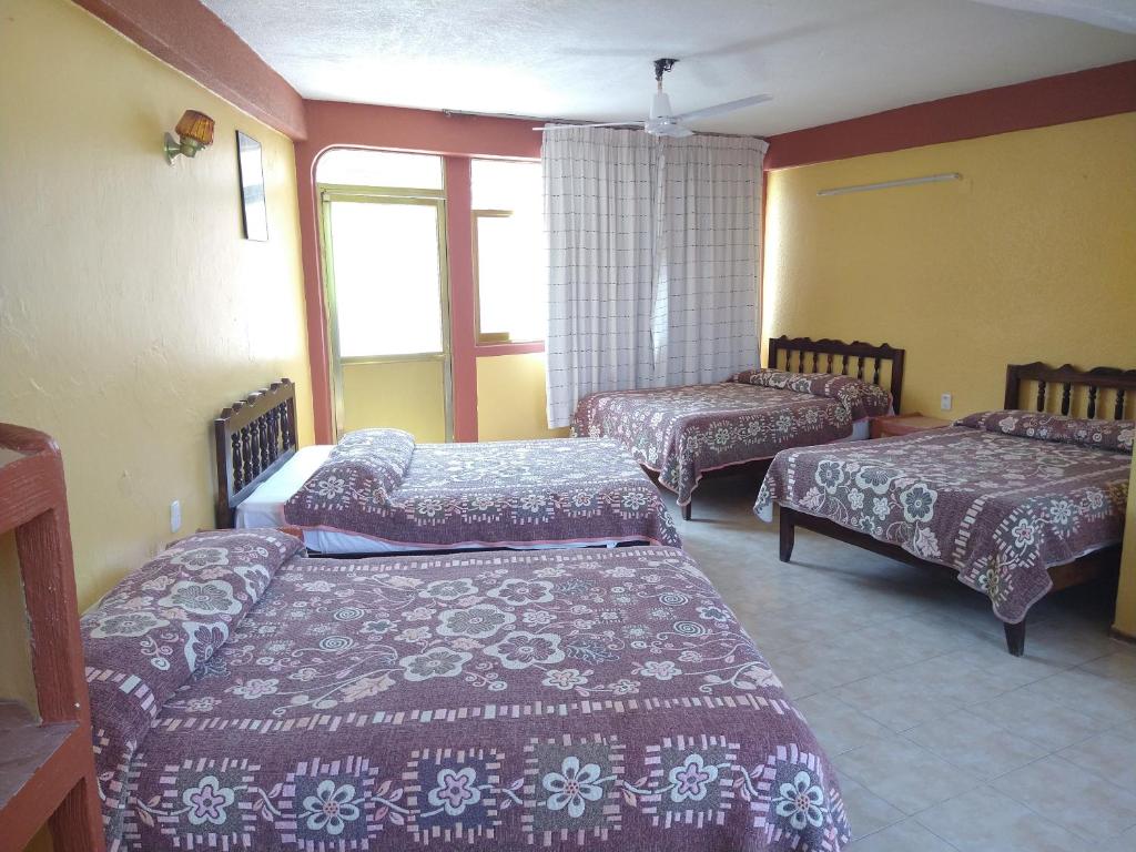 Letto o letti in una camera di Hotel Olimar